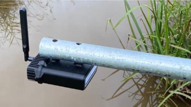 Image showing a UDlive sensor device installed over a stream.